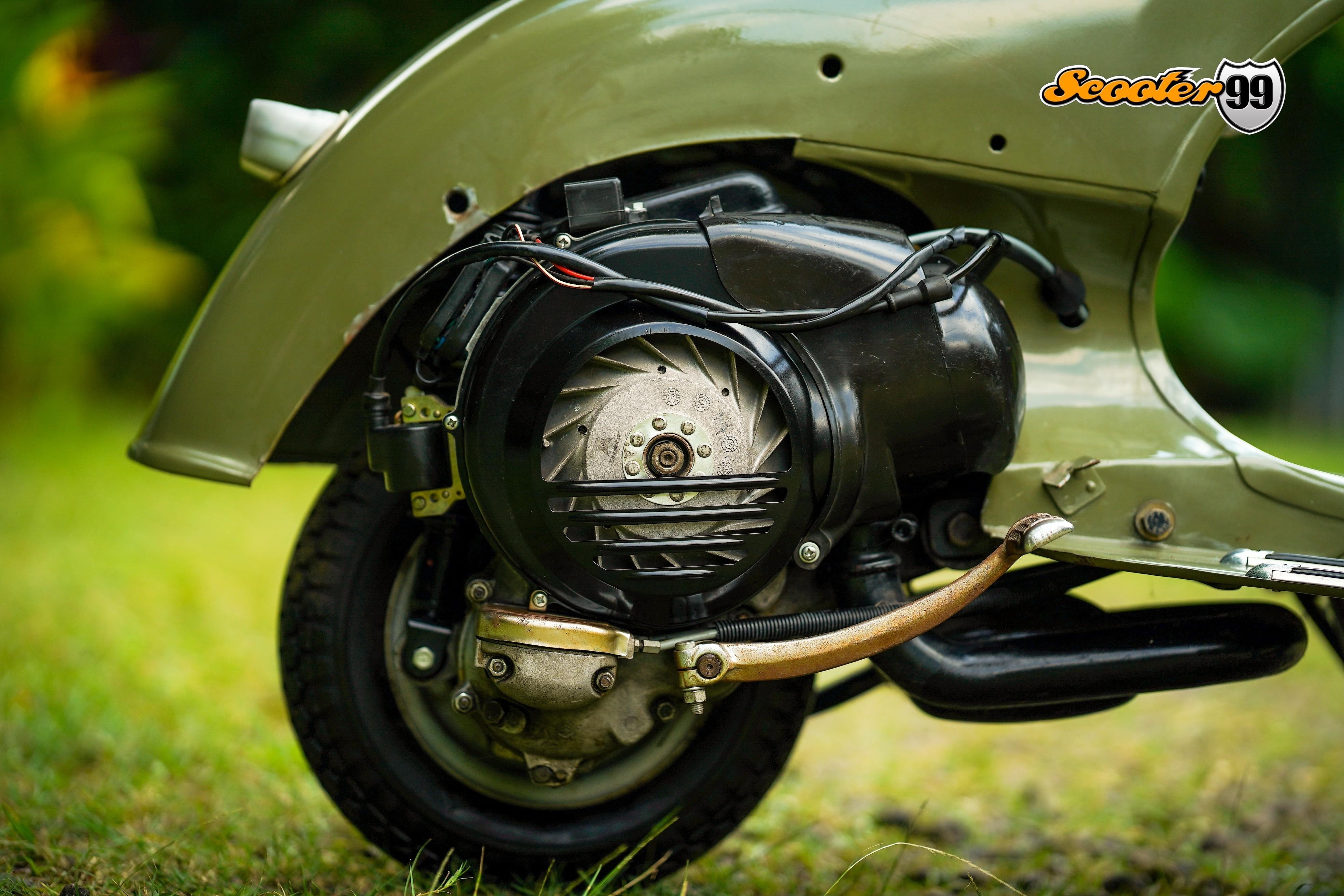 Close-up of a classic Vespa engine being restored in a workshop, symbolizing Jakarta's enduring motor culture.
